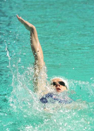 Female swimmer doing backstroke